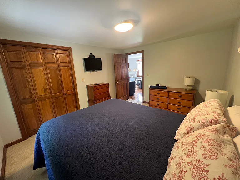 2nd bedroom with queen sized bed, large closet and two dressers