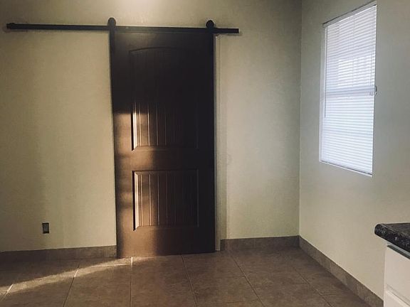 Dinning area. Barn door opens to laundry room