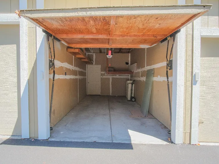 One car garage, with additional storeage area in the back of it