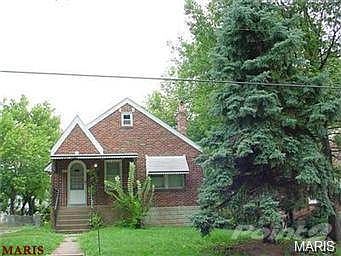 Nice brick bungalow with covered front porch.