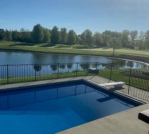 The glorious pool overlooks the pond, golf course and Lake Charles.