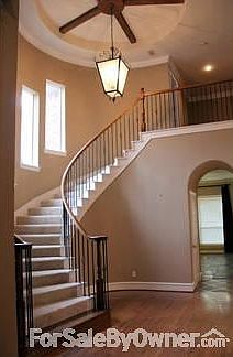 Impressive Two-Story Entry
						:
						Custom chandelier