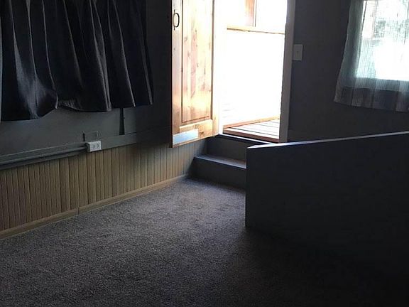 bedroom and door to roof top deck