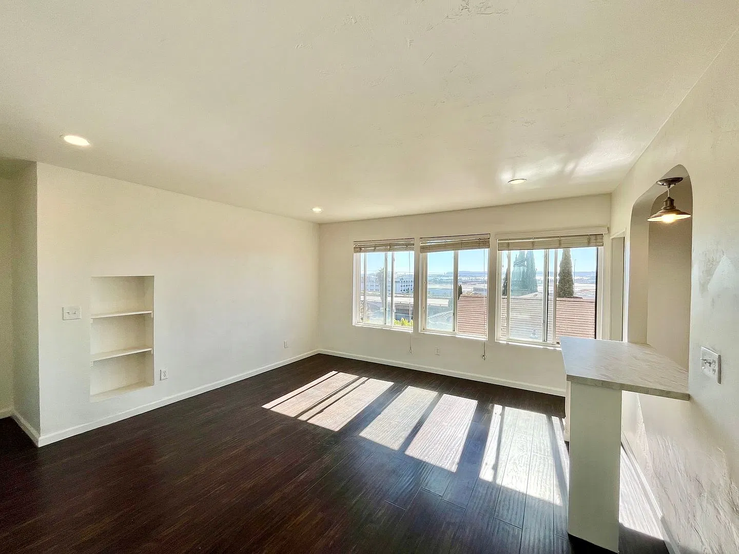 Spacious Studio with Archways, Kitchen Island, Onsite Laundry, and Natural Light! — Photo 1