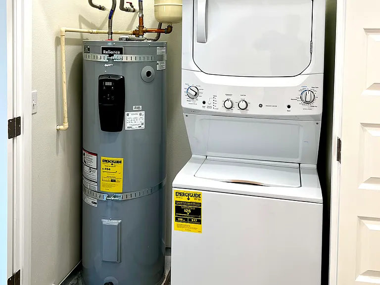 Washer and dryer, water heater closet.