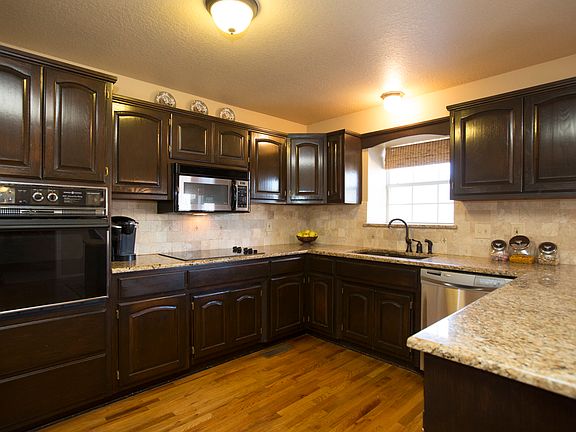 Spacious Kitchen boasts new stainless steel appliances including dishwasher, cooktop and built in microwave.