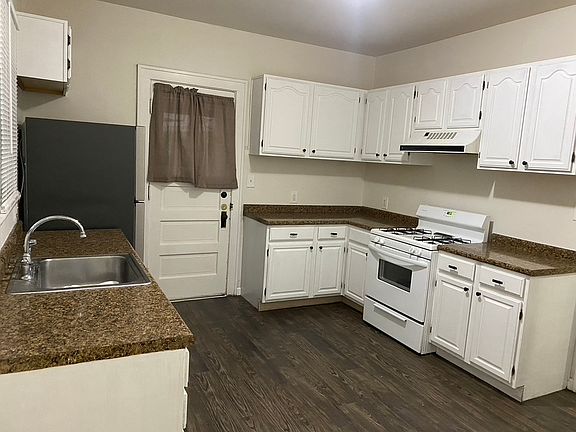 Kitchen with Refigerator, Dishwasher , and Stove Top