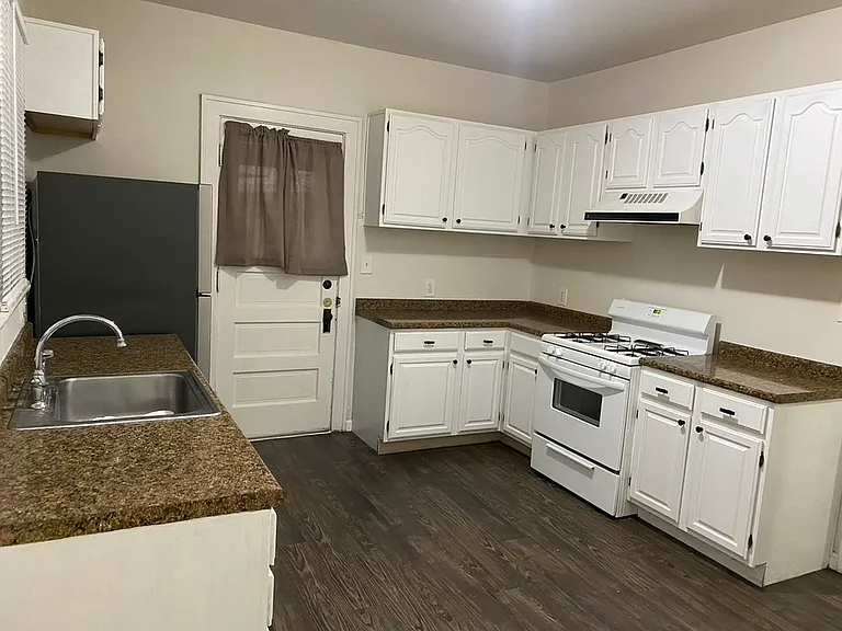 Kitchen with Refigerator, Dishwasher , and Stove Top