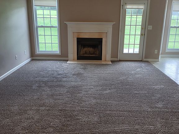 Living Room w/Ceiling Fan and Fireplace 8/2025