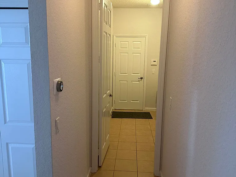 Master bedroom entry:
- Front = internal door of the garage
- Left = access to the kitchen.