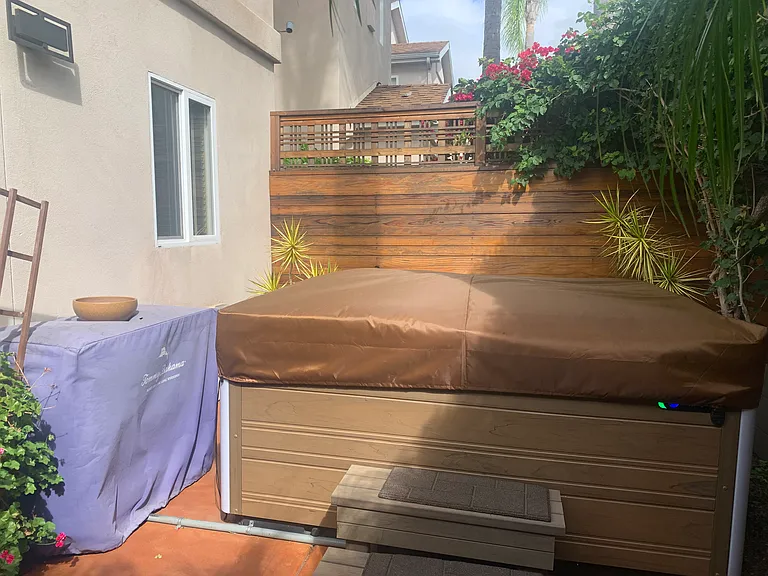 Outside Fenced Private Tropical Patio with Luxurious Hot Tub with Lighting and Bluetooth Speakers