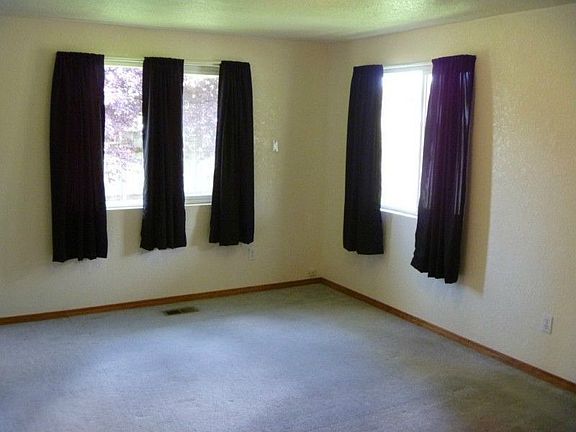 The master bedroom is filled with natural light with an adjoining bathroom and walk in closet.