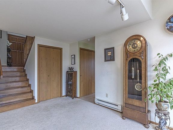 Entry door above; left at the top of the first flight of stairs is the master suite; the second stairs lead to private guest bedroom/bath.  Doorway to the right is the kitchen.