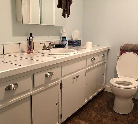 The main bathroom is the first door on the left as you go down the hall