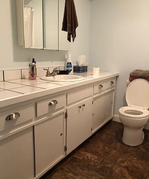 The main bathroom is the first door on the left as you go down the hall