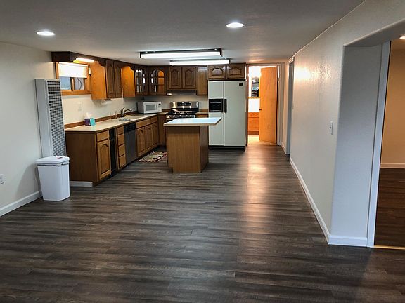 Spacious Kitchen with island. The fridge is now stainless, shown in other pic.