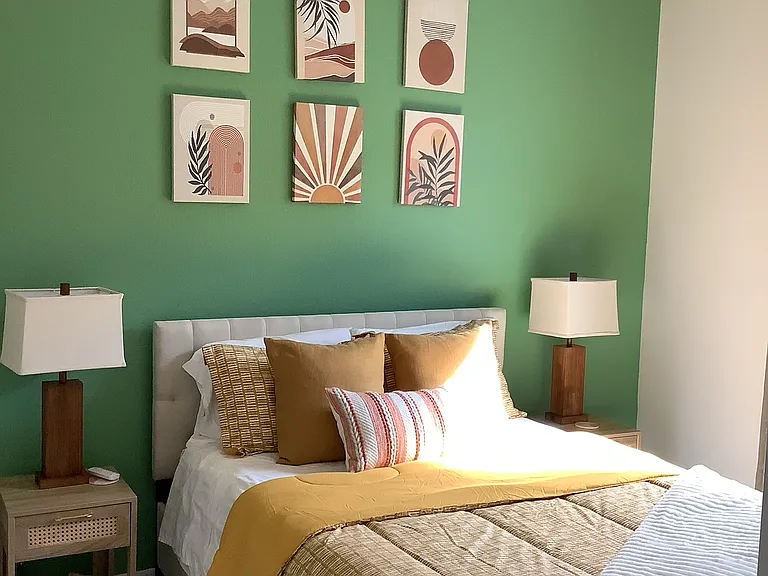 "Comfortable guest bedroom with natural light"