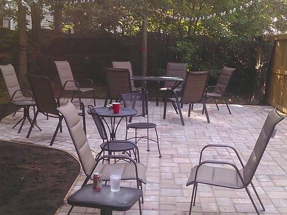 Patio next to deck. You can add lights (plug located in the rails of the deck). The rounded part was designed to add fire pit.