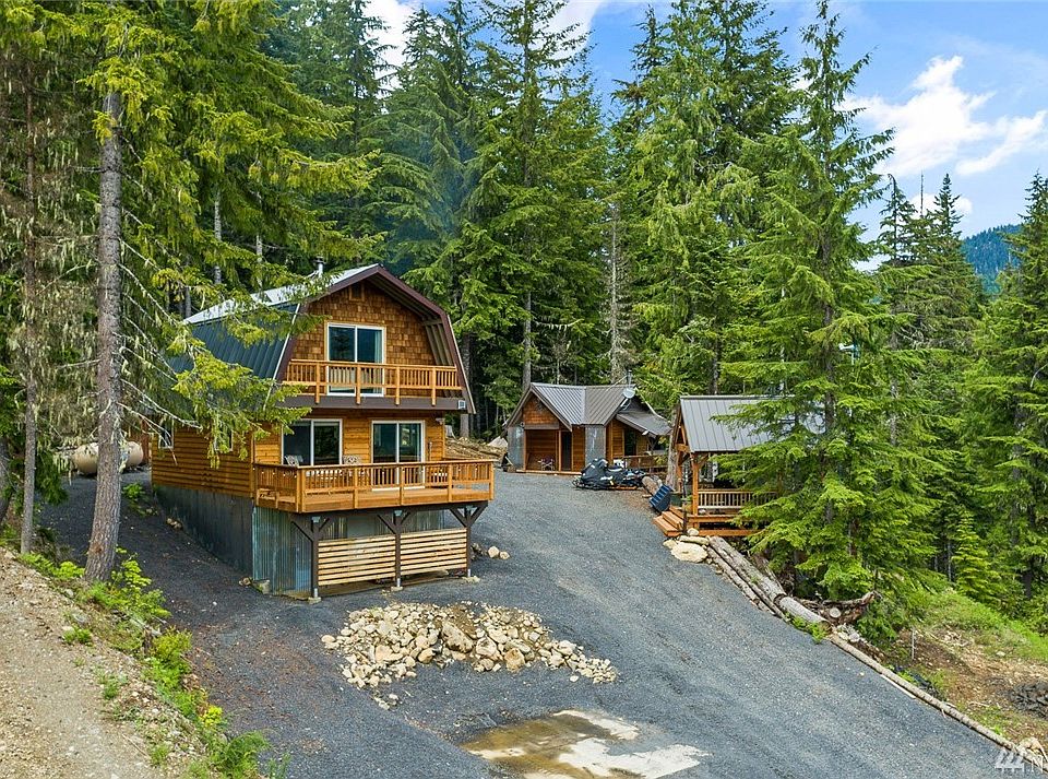 Impeccable location, at the very top of Roaring Creek. Gated property with lit entry. Main Cabin, guest cabin, generator cabin, & outdoor living cabana. All this off grid living with easy to maintain generator power, propane fuel, community water, & a private septic tank. Fresh gravel all around for winter/easy plowing & sledding up.