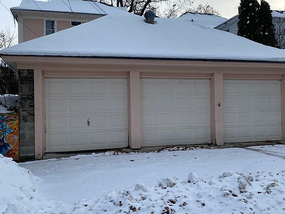 Garage behind house on Lyon with one remote parking spot.