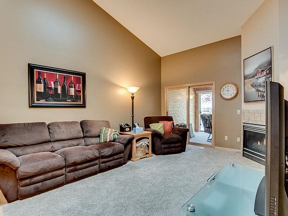 Just off the living room is a a main level bedroom and 3 season porch.