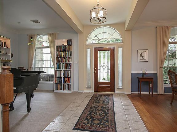 Entryway with Updated Lighting to Greet Family and Friends.