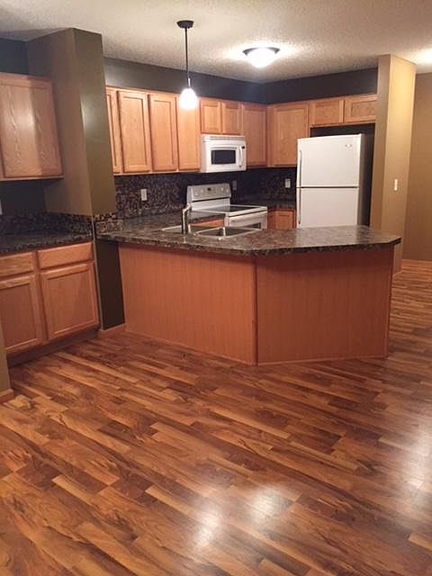 Kitchen with Breakfast Bar and Built in Buffet