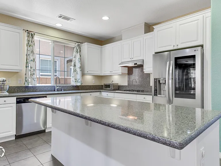 Kitcheb with granite counters & plenty of storage