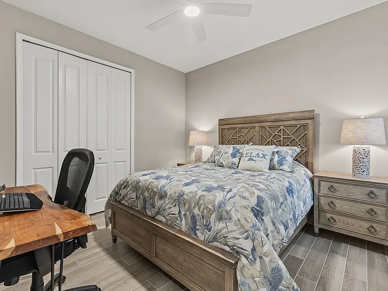 Bedroom #2 with large closet and ceiling fan.
