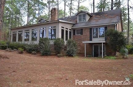 Back of house showing ground entrance to basement