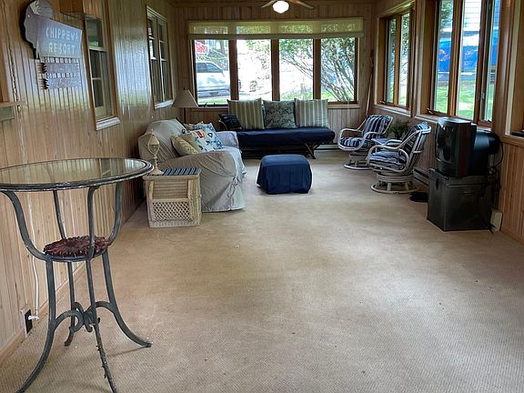 Large sun room overlooking backyard