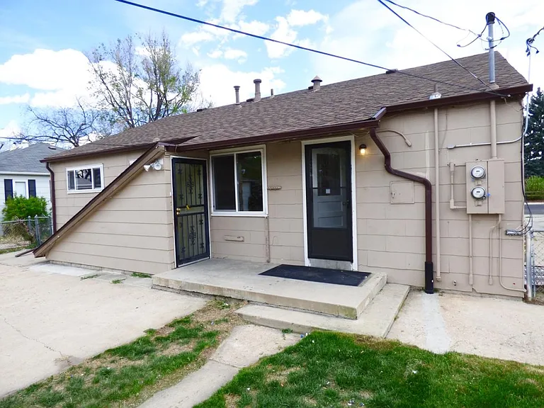 Rear entrance to unit and private patio. Nice fenced in yard