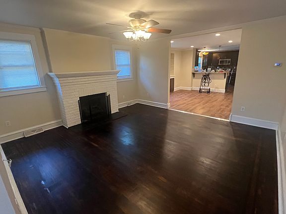 Living room (hardwood floor, ceiling fan gas fireplace)