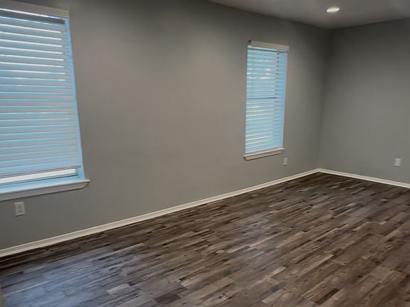 Living area with plenty of space for 2 couches or sectional seating