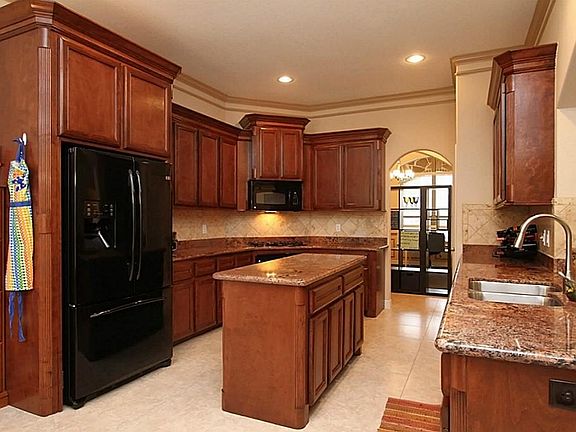 Great kitchen with Granite countertops, tile backsplash, movable island, 42" cabinets.