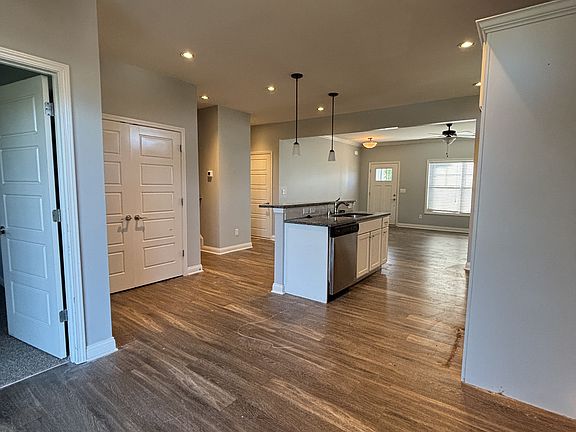 View from dining room into kitchen and living room area.