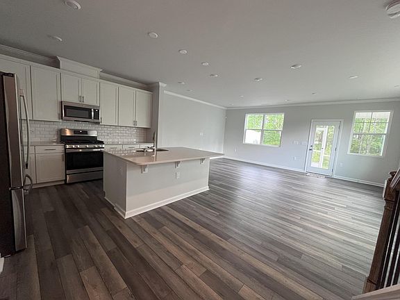 LVP flooring throughout the first floor for easy maintenance and durability Generous white cabinets with ample quartz counter space for prep or serving