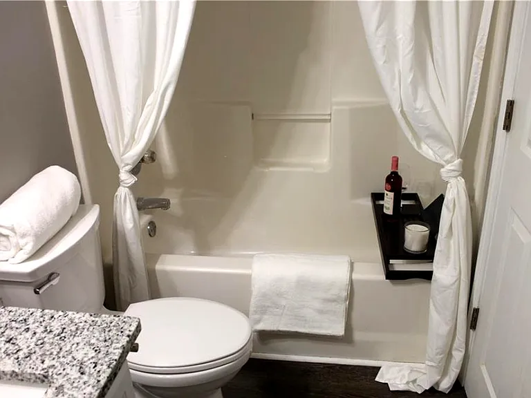 Full Bathroom #1 featuring a shower with shower curtain