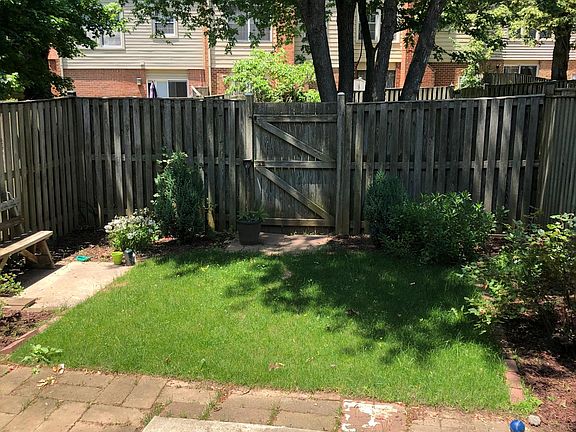 Back yard that opens to a spacious common area.
