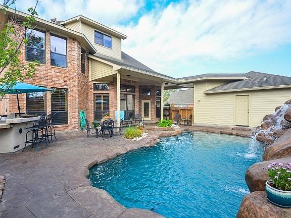 Backyard dream come true! Spacious covered patio and surround deck invite you to enjoy all the outdoors offers with this refreshing pool.