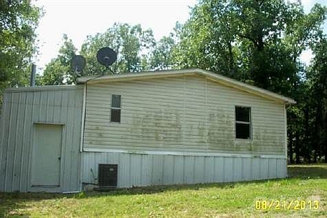 Wood burning unit in attached shed.