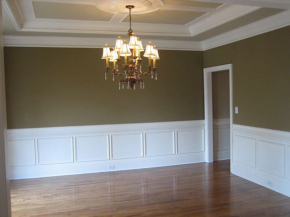 Bright dining room with detailed crown molding