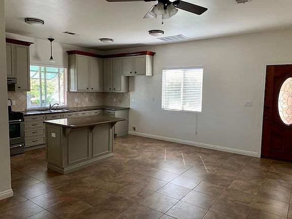Entry door, kitchen and living room area