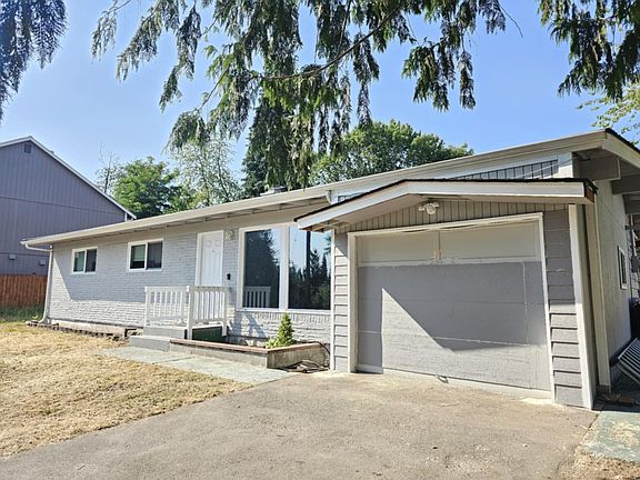 Exterior angle view, view of garage and paved parking space