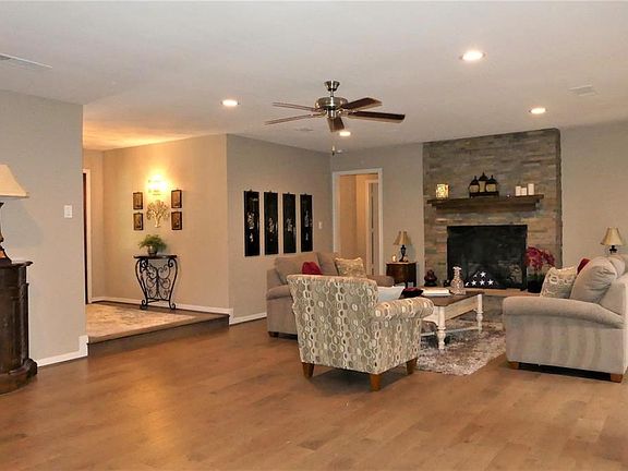 Spacious Living Room with woodlook tile floor.