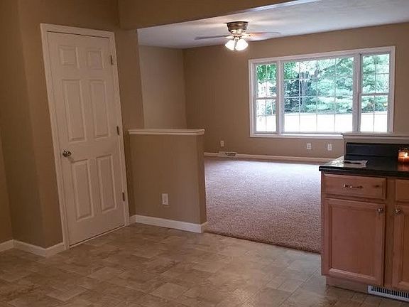 View from Kitchen into Living Room
						:
						Open Kitchen/Dining Room/Living Room. Door on the left is pantry.