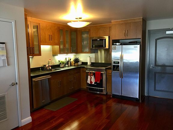 Kitchen featuring stainless steel appliance and abundant sto