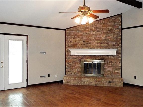 Double french doors lead to backyard from living area.