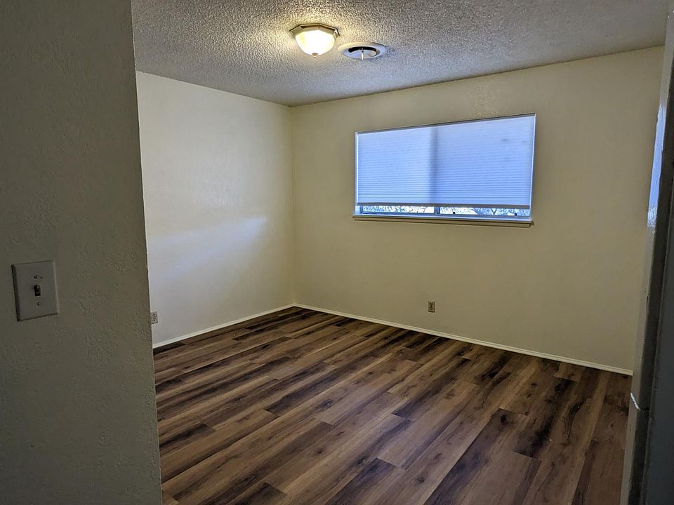 Bedroom with closet. New flooring and fresh paint on all walls and new shades.