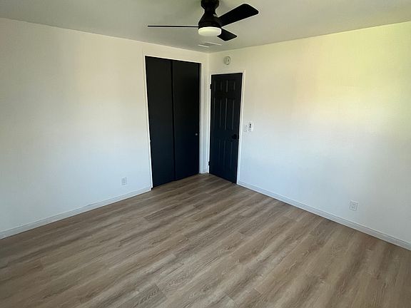 Second bedroom looking at door and closet